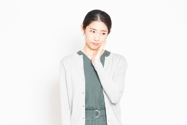 お口のトラブルに悩む女性
